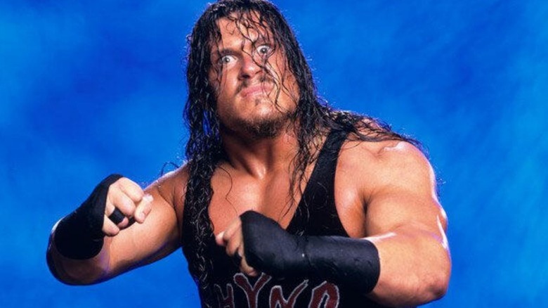 Rhyno poses in his ring gear in a backstage photoshoot for WWE.