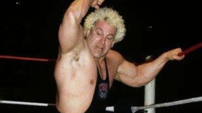 Ken Patera looks to deliver an elbow drop to an opponent in the ring in a retro photo posted to WWE.com.