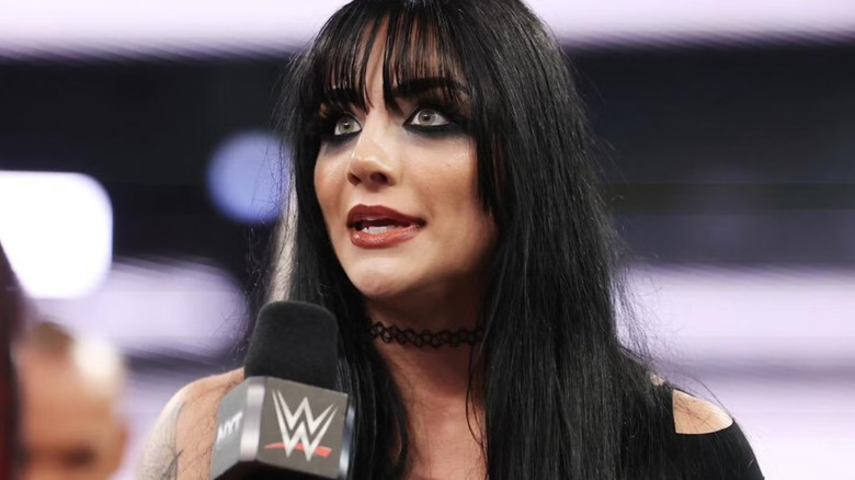 Tatum Paxley holding a microphone