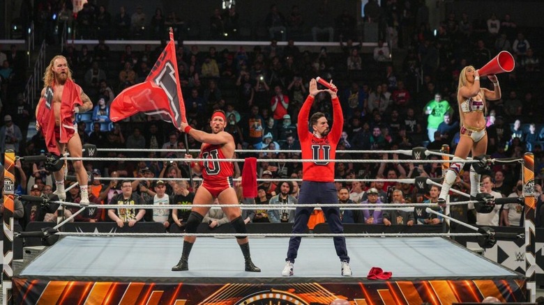 Tyler Bate, Ridge Holland, Andre Chase, and Thea Hail pose in the ring as Chase University ahead of a match on 