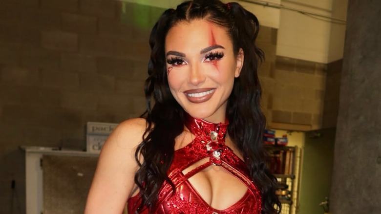 Jazmyn Nyx posing for a picture backstage at NXT Halloween Havoc 2024.