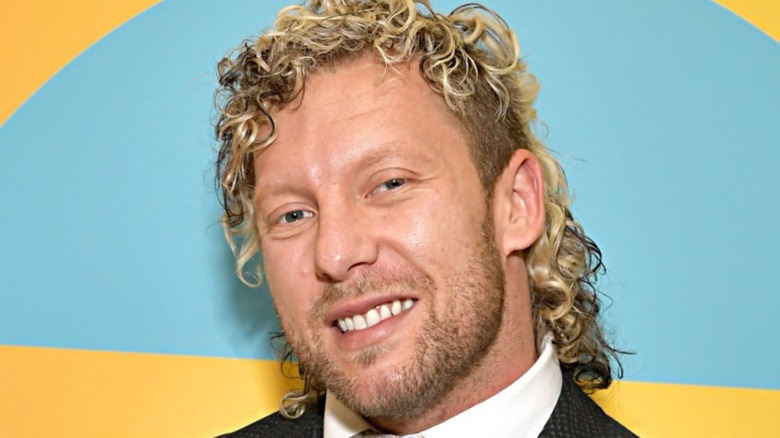 Kenny Omega posing at a promotion event