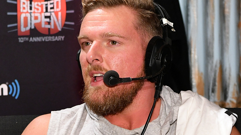 Pat McAfee speaking on a headset