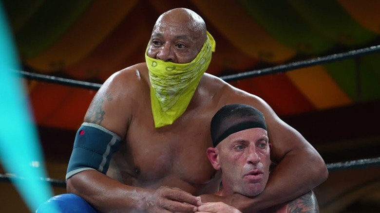 2 Cold Scorpio puts a headlock on Grim Reefer