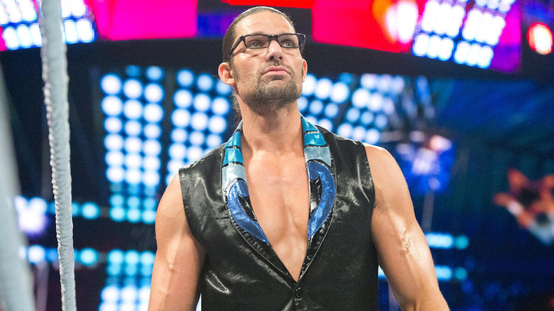 Adam Rose, wearing glasses