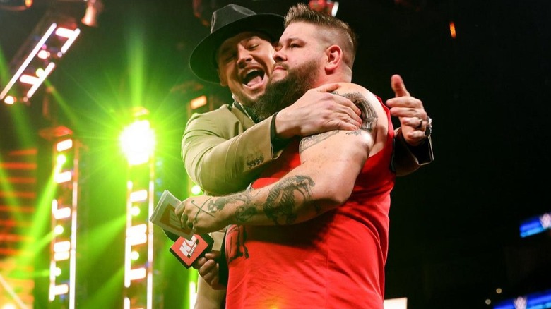 "Happy" Baron Corbin gives Kevin Owens a hug while on "The Kevin Owens Show."