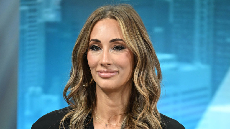 Carmella on a talk show set