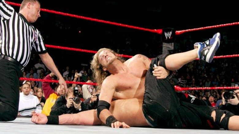 Edge pins John Cena in the ring as the referee makes the count during the first-ever cash-in of the Money in the Bank briefcase.