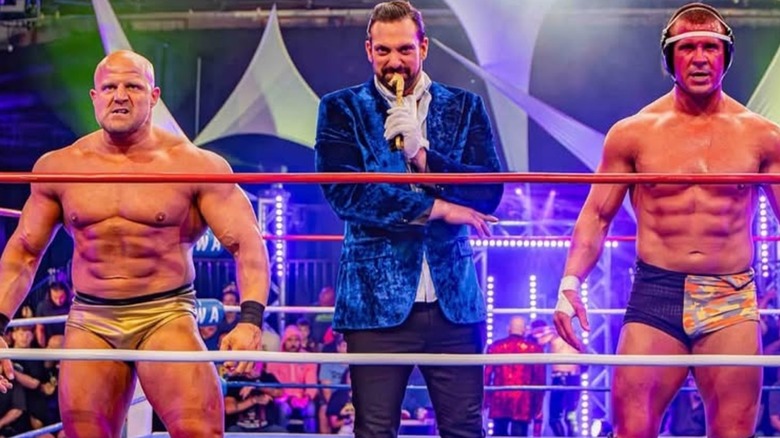Aron Stevens alongside Mike Mondo and Spencer Slade during an NWA show.