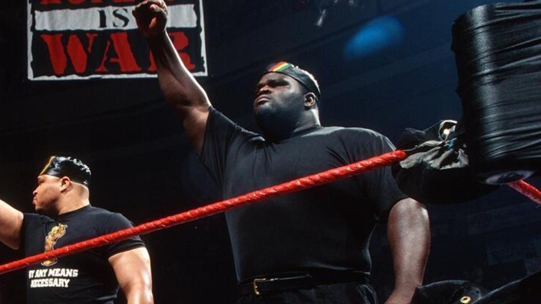 Mark Henry with D'Lo Brown and the rest of The Nation of Domination during an episode of "RAW IS WAR."