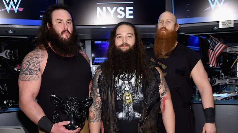 Former WWE Superstar Erick Rowan poses with Braun Strowman and the late Bray Wyatt