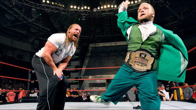 Triple H and Hornswoggle during a segment on "RAW."