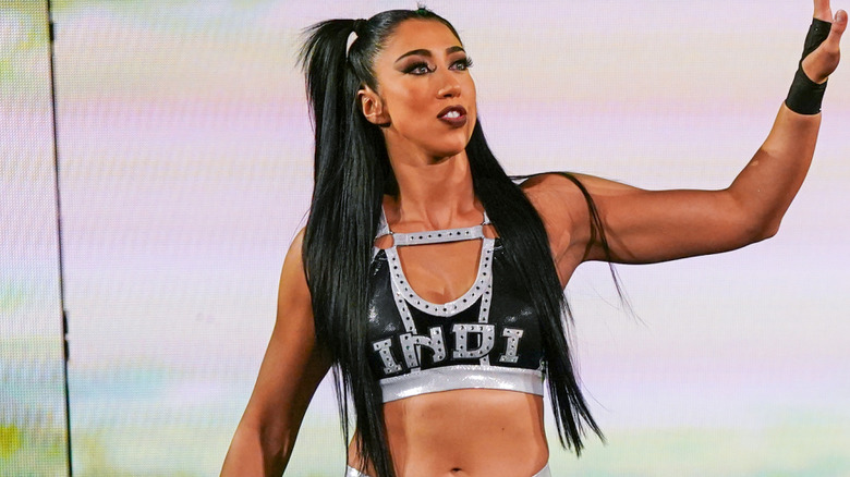 Indi Hartwell raising her arm