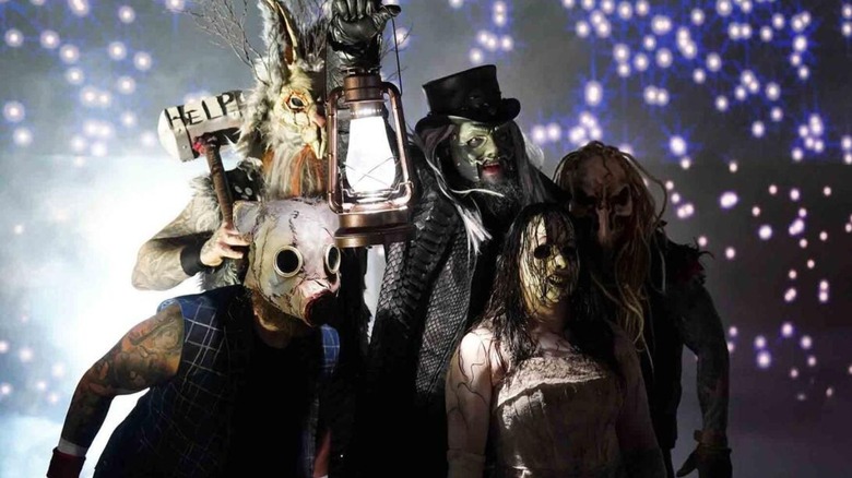 The Wyatt Sicks, led by Uncle Howdy, holding the lantern, head down to the ring before a tag team match on a September 2024 episode of 