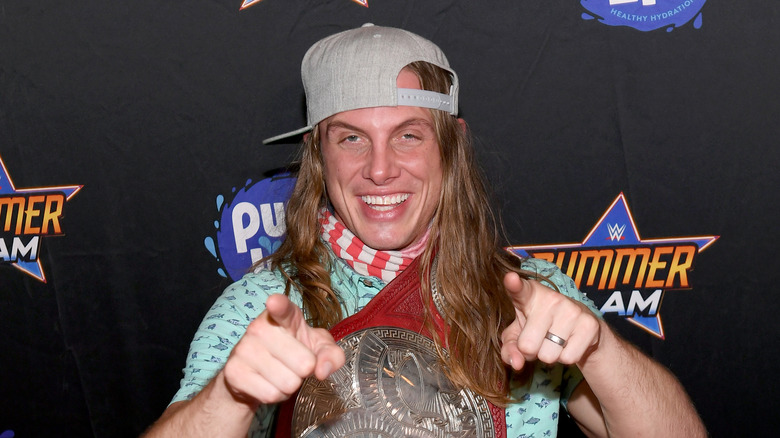 Matt Riddle with a WWE Tag Title belt