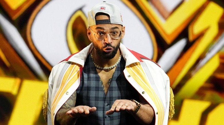 Ricochet taunts his way down to the ring.