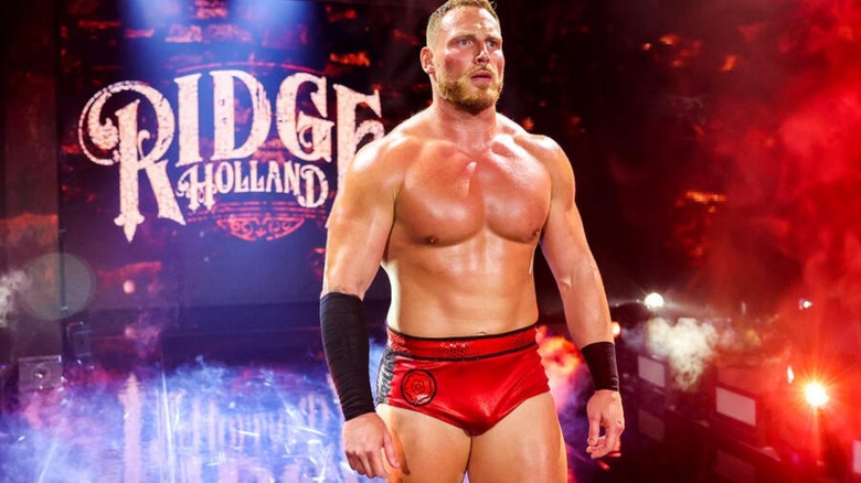 Ridge Holland stands on the entrance ramp and looks toward the ring before a match on WWE programming.