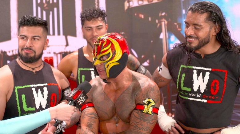 Raul Mendoza, Joaquin Wilde, Rey Mysterio, and Santos Escobar during a post-match interview at WrestleMania 39.