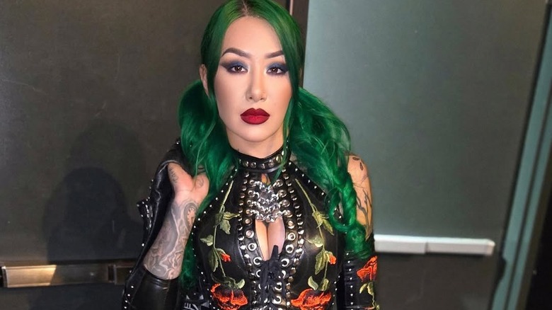 Shotzi, backstage during a GCW show, showing off her new gear on the Indies.