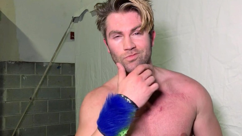 Tyler Breeze posing backstage