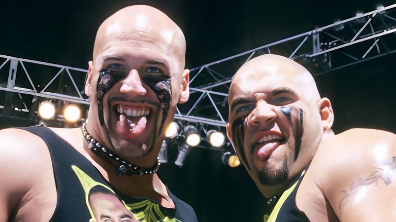 The Headbangers sticking out tongues