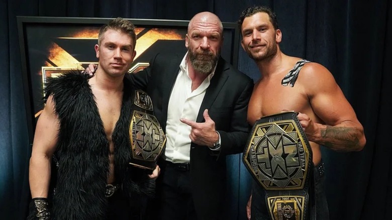 Tyler Breeze, Triple H, Fandango backstage at 