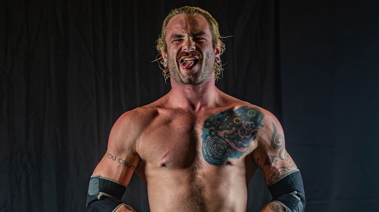 Colby Corino poses backstage at a wrestling show in a photo posted to his X account.