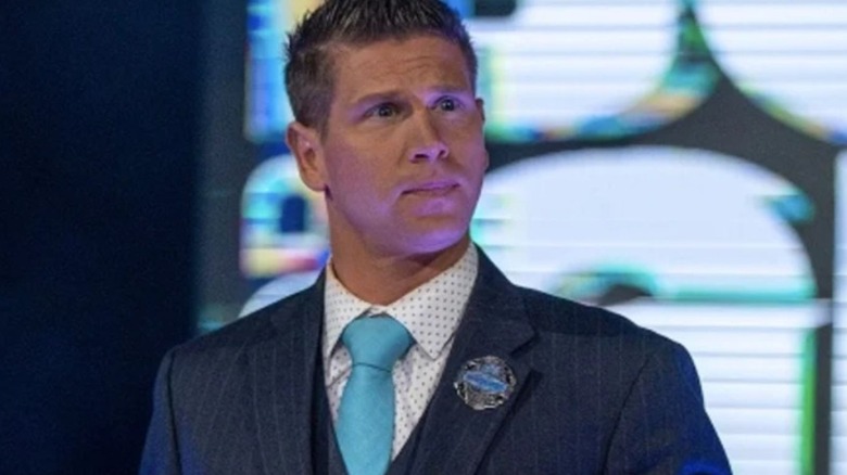 Josh Matthews stands onstage during an episode of TNA programming.