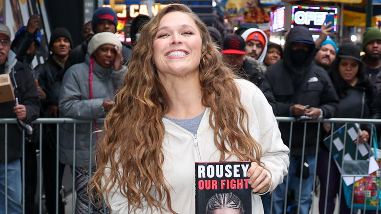 Ronda Rousey holding her memoir