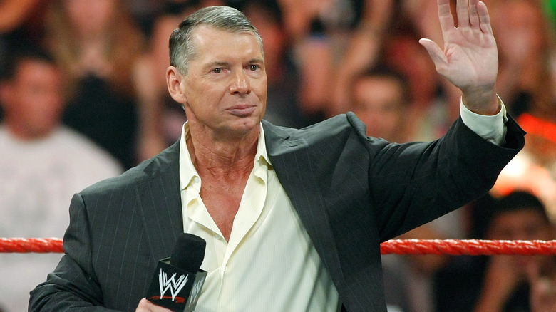 Vince McMahon raising his hand