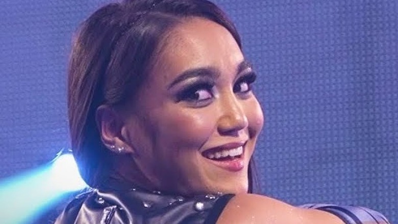 Roxanne Perez smiles in the ring 