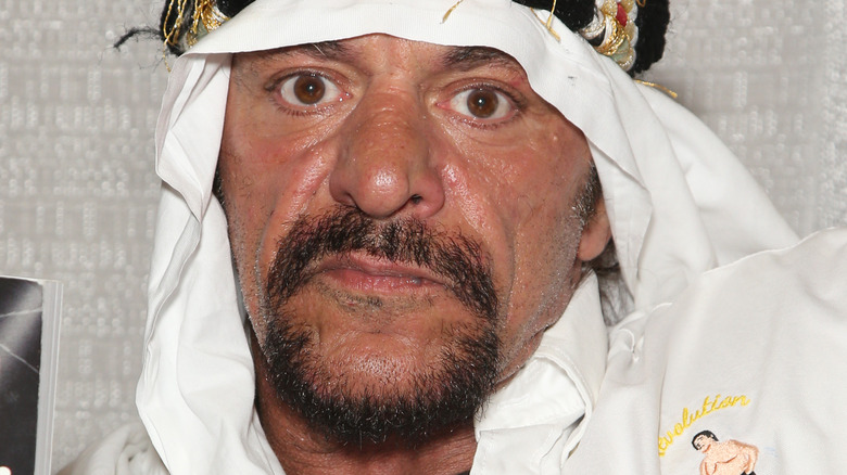 Sabu looking into camera