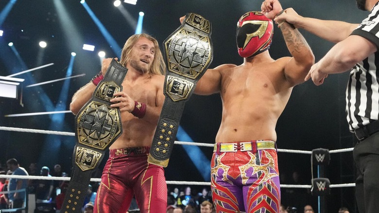 Nathan Frazer and Axiom celebrating after successfully defending the NXT Tag Team Championships.