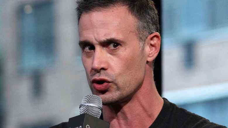 Freddie Prinze Jr. talking into a microphone