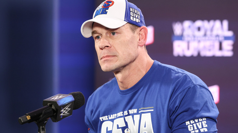 John Cena wearing a blue and white baseball hat