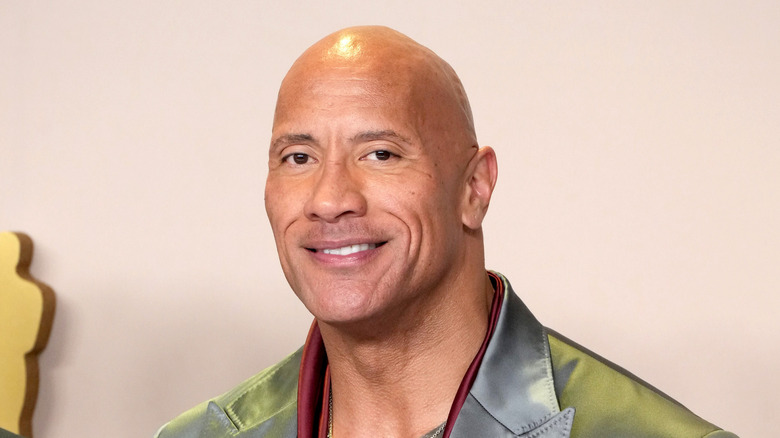The Rock grins