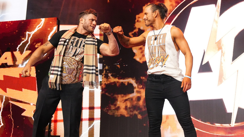 MJF and Adam Cole fist bumping