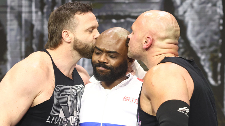 FTR kissing Stokely Hathaway on the head