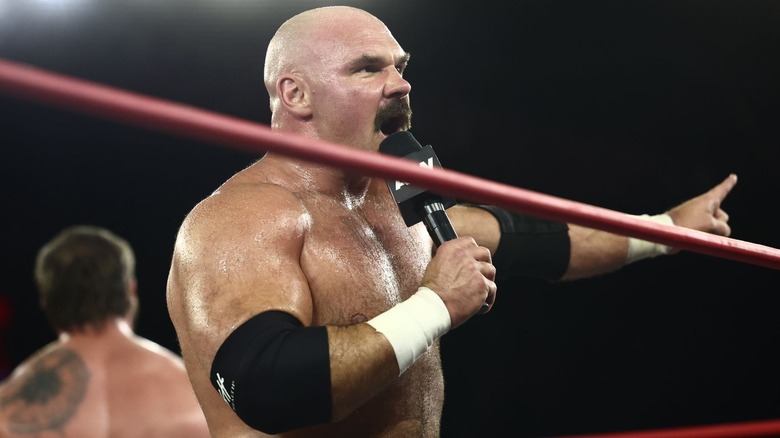 FTR's Dax Harwood speaks in the ring