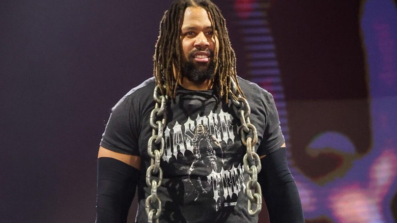 Jasper Troy walks to the ring, signature chains around his neck, before a match on an episode of 