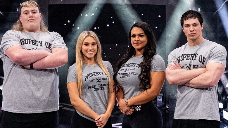 Marcus Brown, far right, stands alongside fellow WWE Performance Center recruits, including Mason Rook and Nikki Blackheart, following their signing.