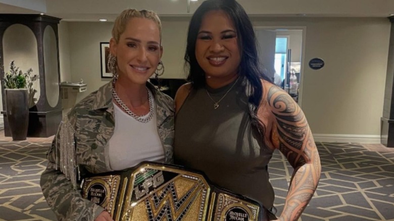 PJ Vasa poses alongside "WWE LFG: Legends & Future Greats" coach Michelle McCool, along with a replica WWE Championship belt, in a photo posted to Vasa's Instagram account.