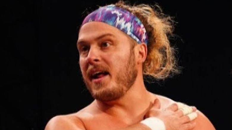 Joey Janela puts hand on chest