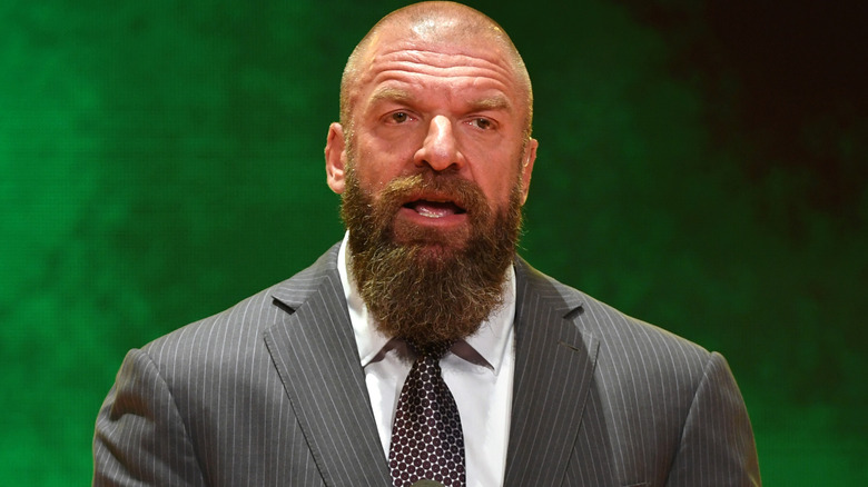 Triple H wearing a suit