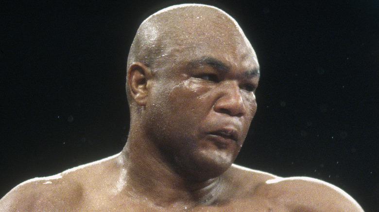 George Foreman throws punch