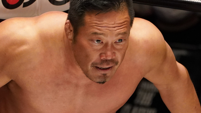 Takashi Sugiura standing in the corner of a wrestling ring