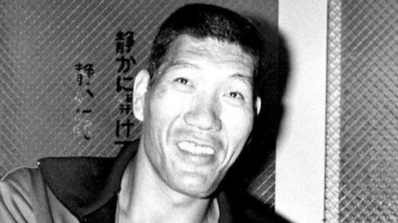 Giant Baba smiles