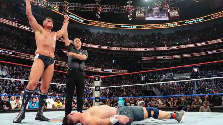 GUNTHER stands over a fallen John Cena after his win over the legend in his final match at Saturday Night's Main Event in December 2025.