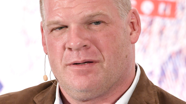 Glenn Jacobs with a microphone