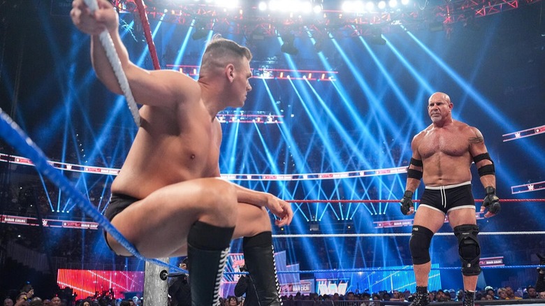 WWE Hall of Famer stares down his opponent GUNTHER as he takes a breather in their intense clashing for the WWE World Heavyweight Championship